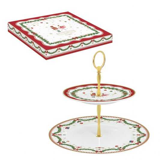Serviteur muet à deux étages en porcelaine décoré de motifs de Noël rouges et verts, avec poignée dorée centrale.